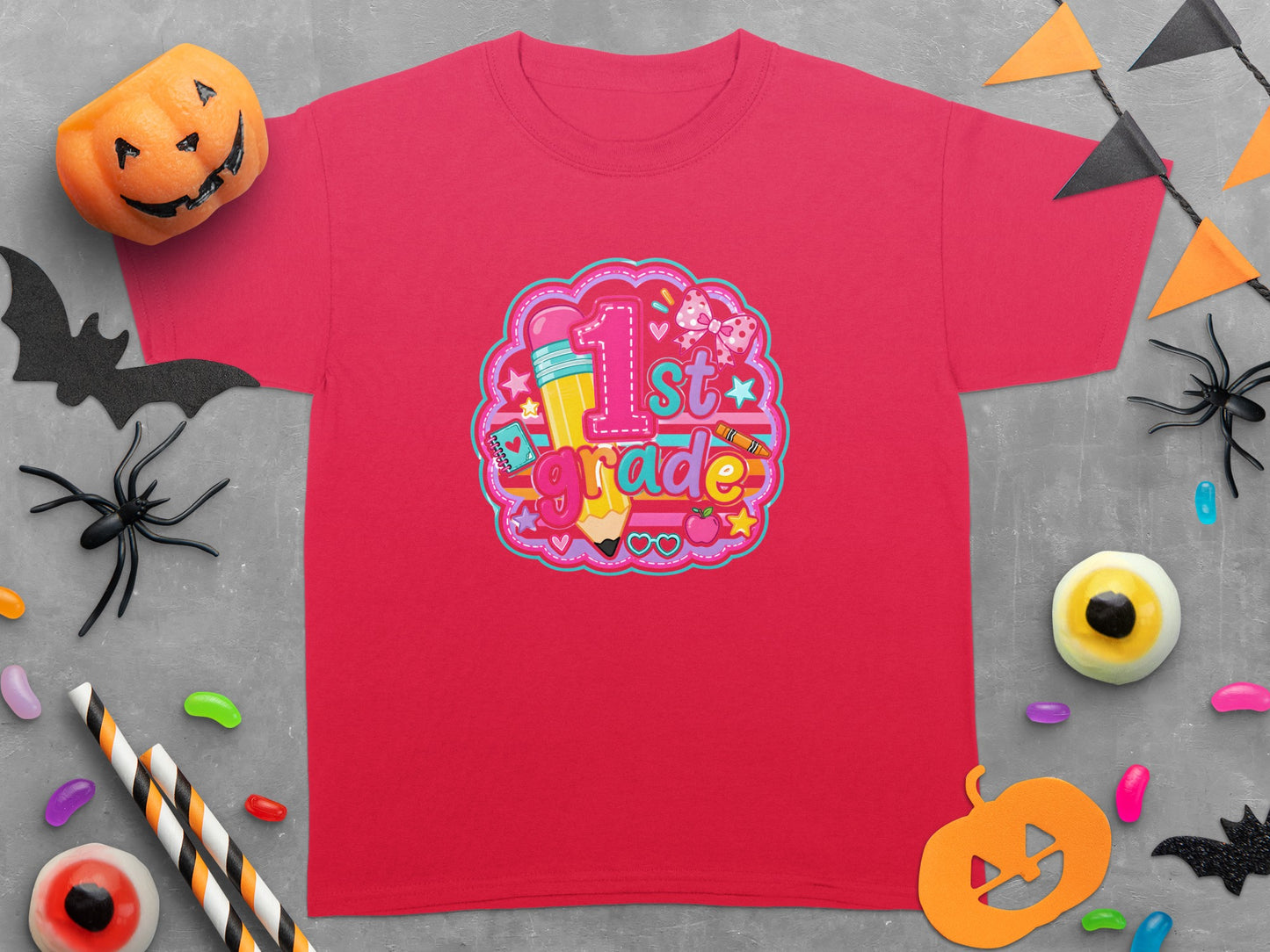 Red t-shirt with "1st Grade" graphic featuring a pencil, crayon, and bow.