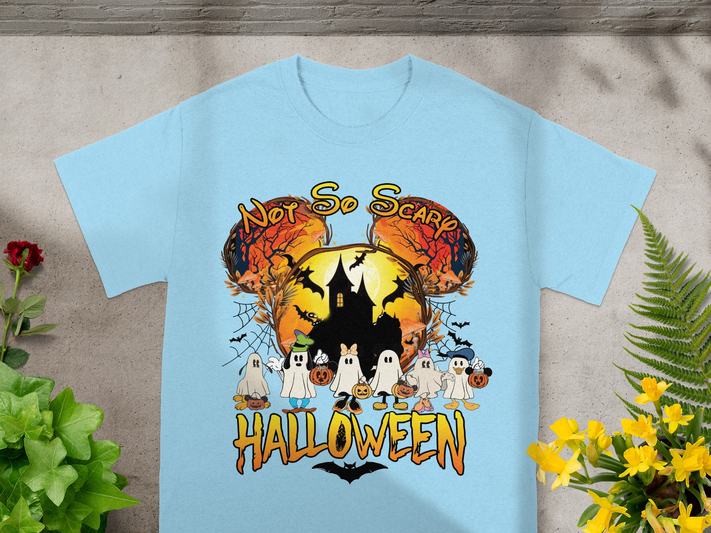 Light blue t-shirt with "Not So Scary Halloween" text and cartoon ghosts.