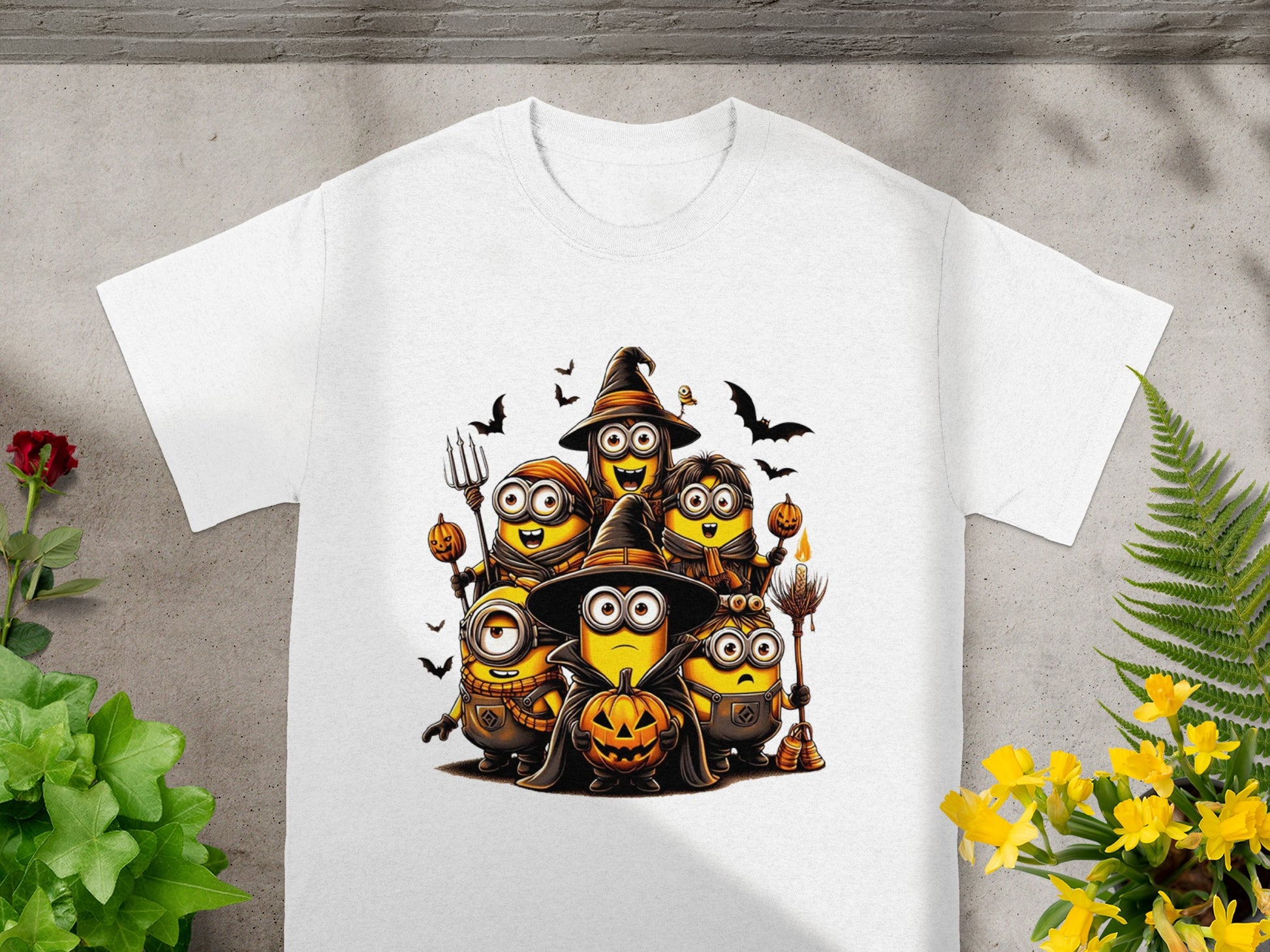 A group of Minions in Halloween costumes, holding pumpkins and broomsticks.
