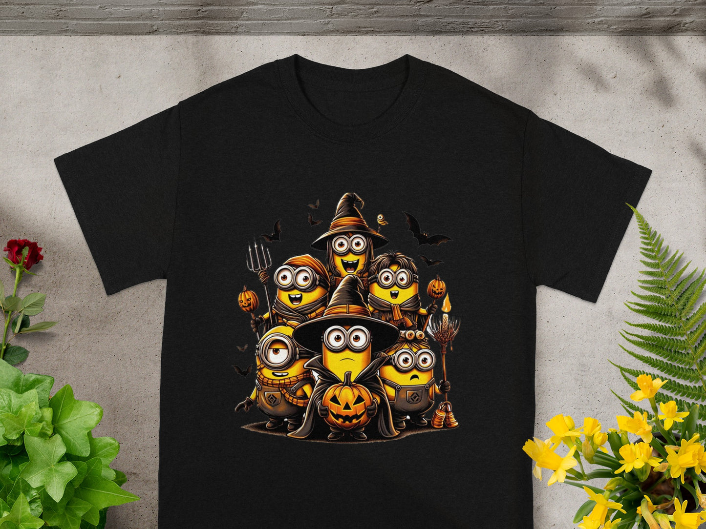 Minions in various Halloween costumes, including witch hats and holding pumpkins.