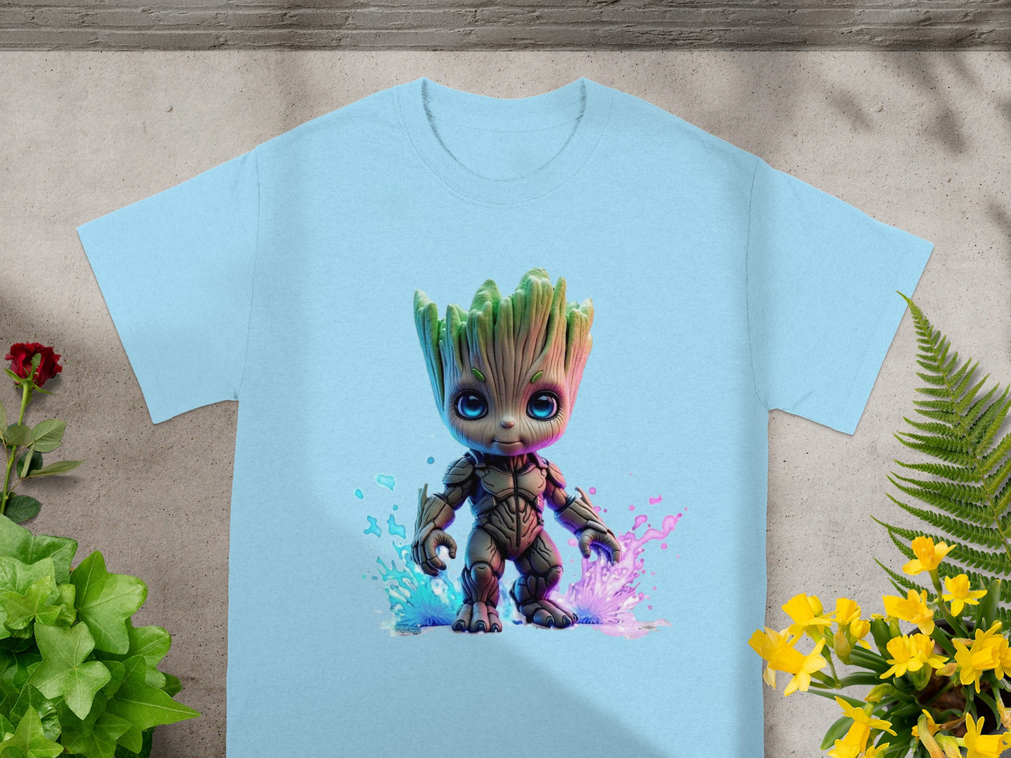 Light blue t-shirt featuring a cartoon Groot character with colorful paint splashes.