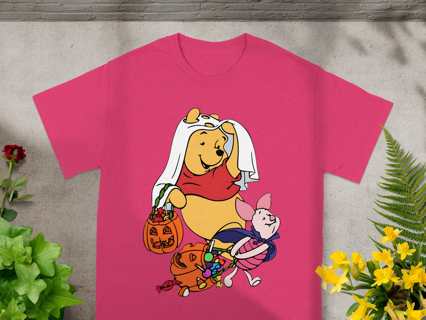 Winnie the Pooh and Piglet in Halloween costumes with candy.