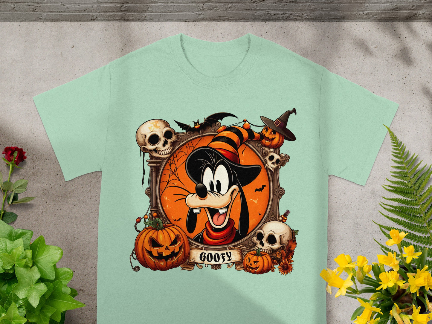 Goofy in a Halloween frame with pumpkins, skulls, bats, and the word "Goofy".