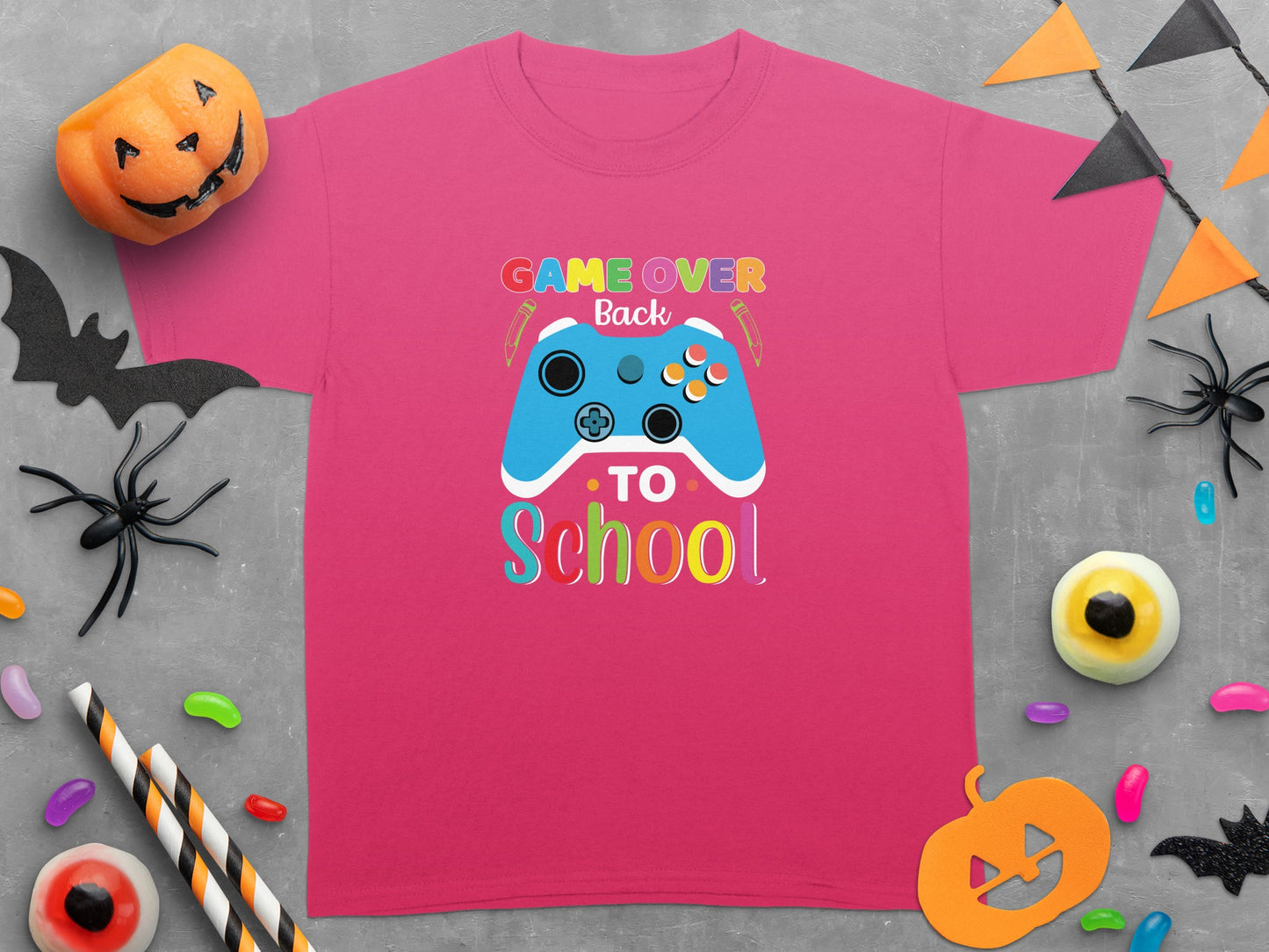 Pink t-shirt with "Game Over Back to School" text and a blue video game controller.