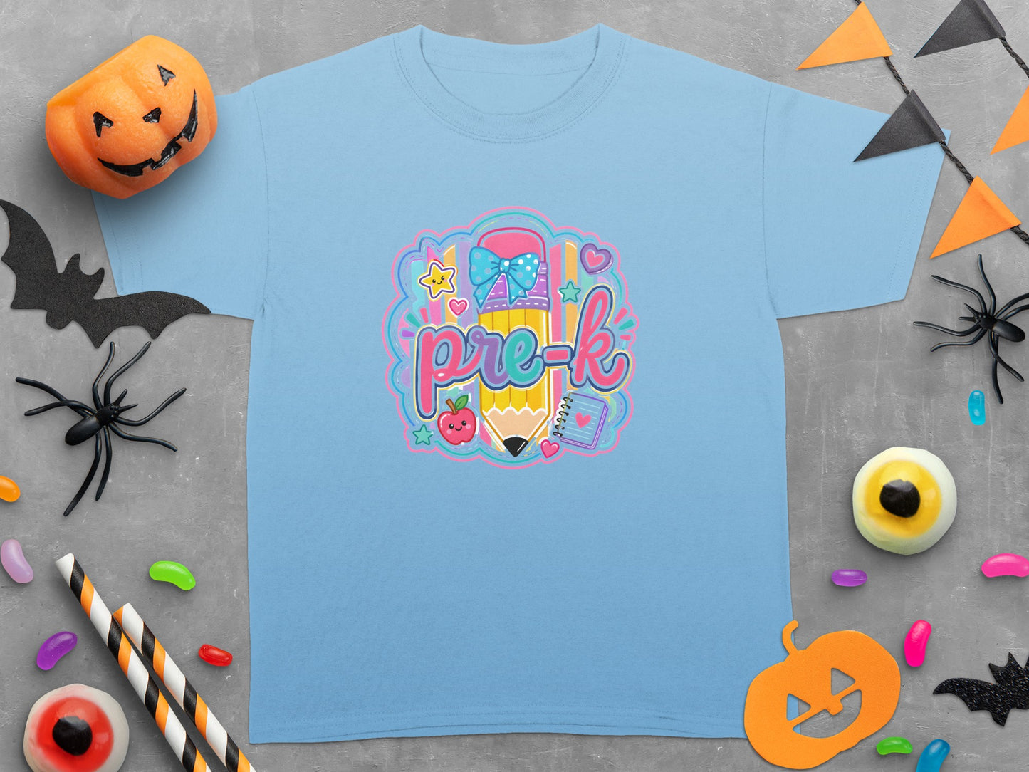 Light blue t-shirt with colorful "pre-k" pencil graphic and Halloween decorations.