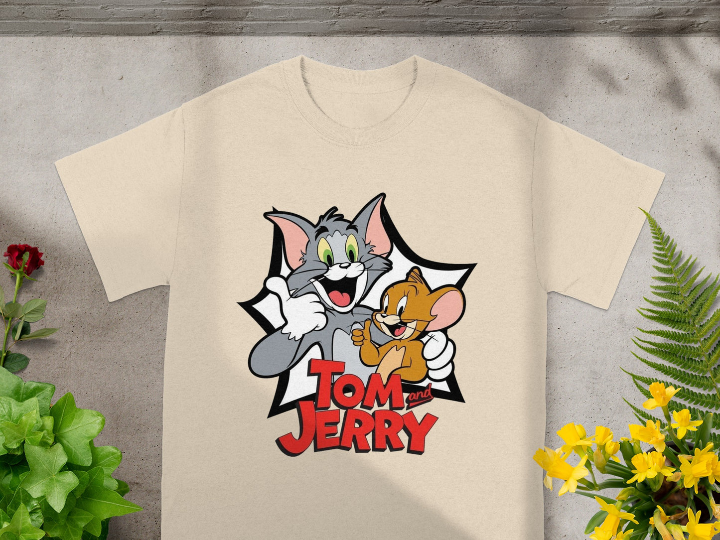 Tom and Jerry characters giving thumbs up on a cream t-shirt.