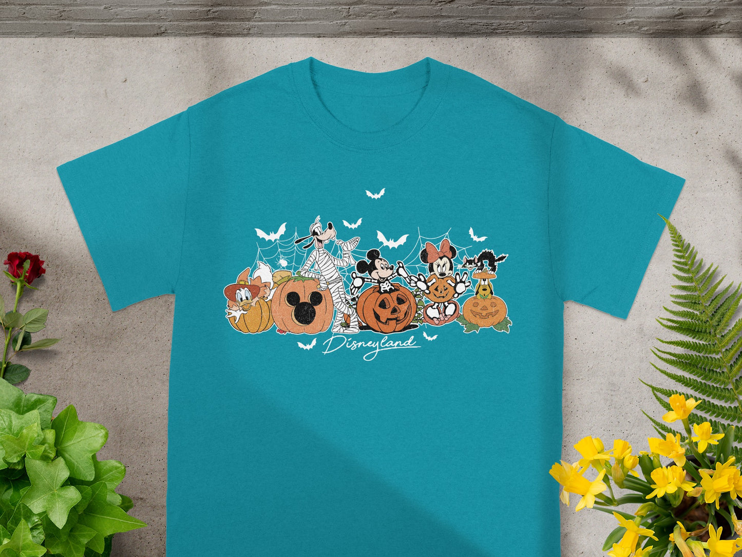 Disneyland Halloween t-shirt with Mickey Mouse and friends among pumpkins.