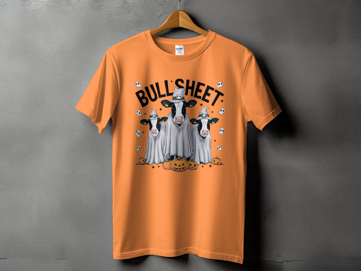 Orange t-shirt with three cows dressed as ghosts and "BULL SHEET" text.