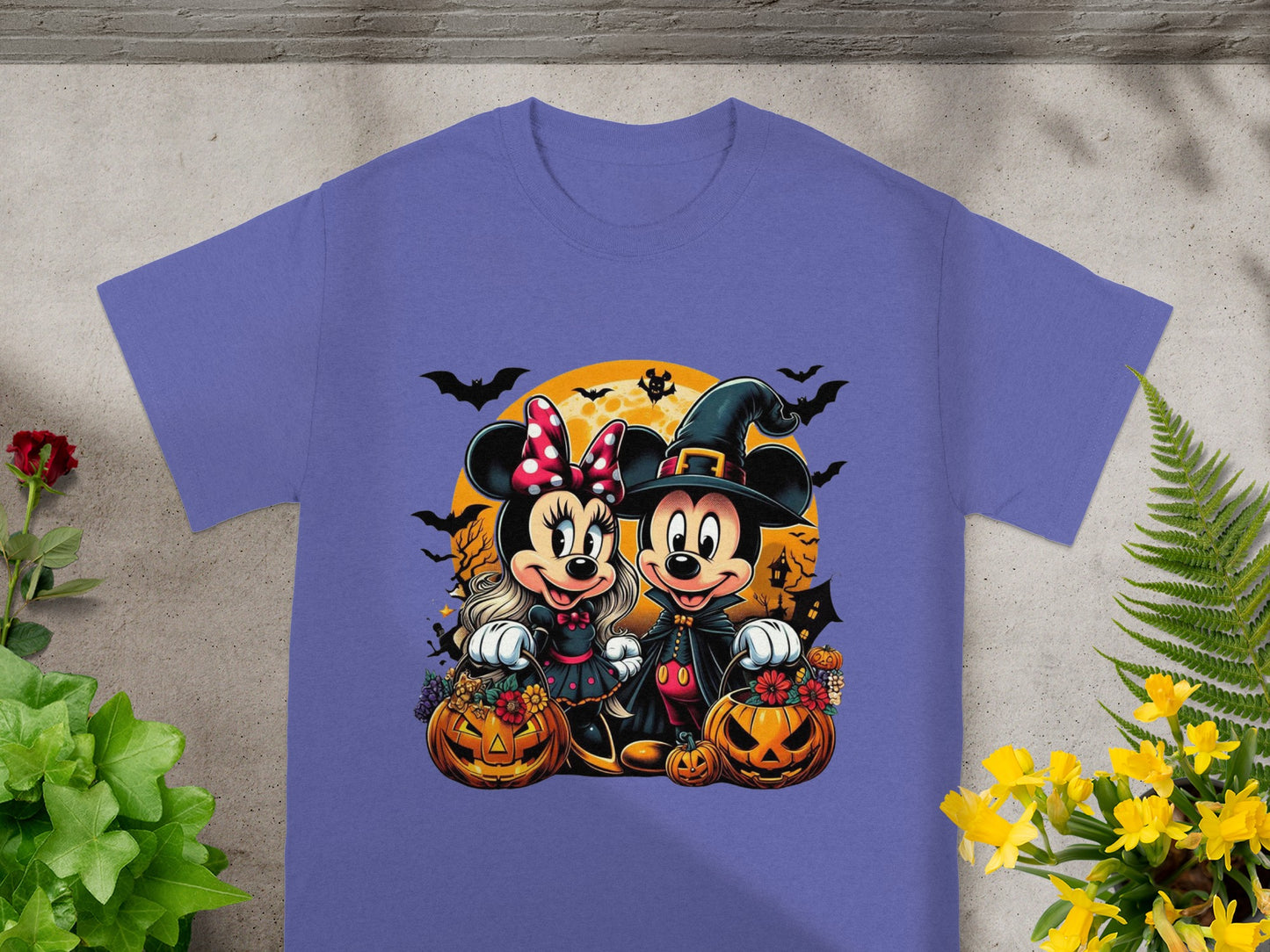 Minnie and Mickey Mouse in Halloween costumes with pumpkins and bats.
