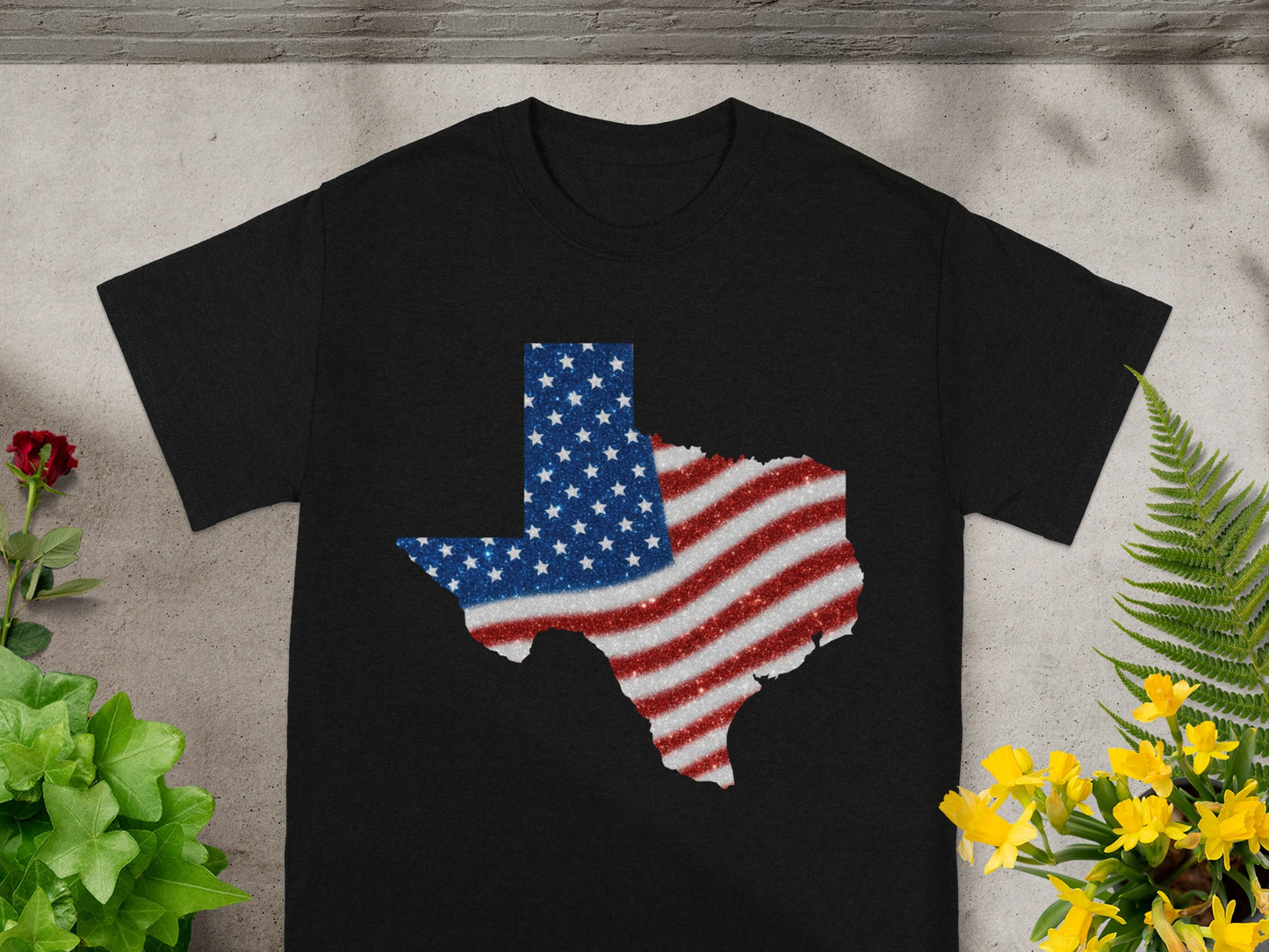 Black t-shirt with a glittery Texas map design in American flag colors.