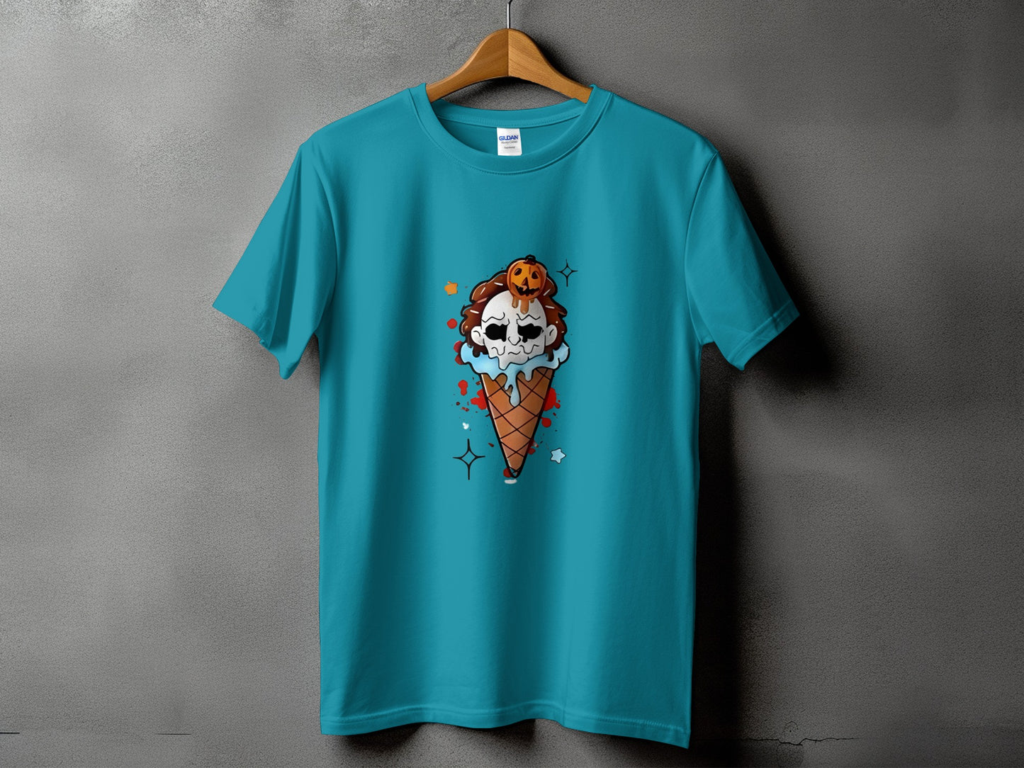 Turquoise t-shirt featuring a Halloween ice cream cone graphic with a skull and pumpkin.