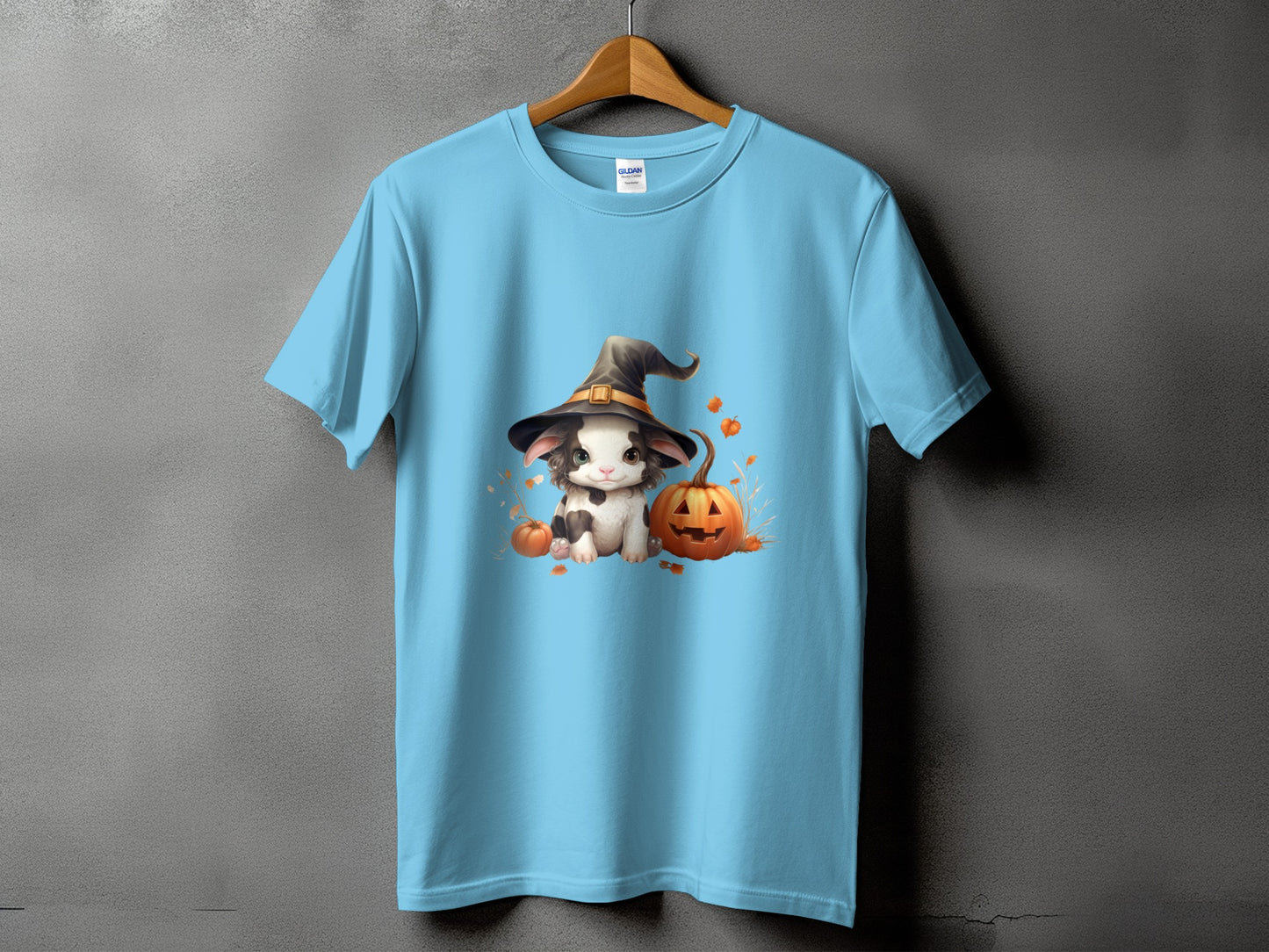 Light blue t-shirt with Halloween bunny in witch hat and pumpkins graphic.