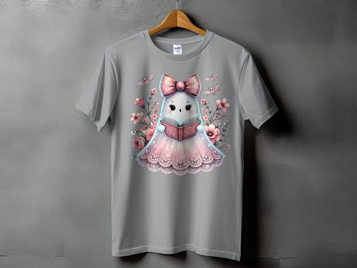 Gray t-shirt with a kawaii ghost wearing a bow reading a book surrounded by flowers.