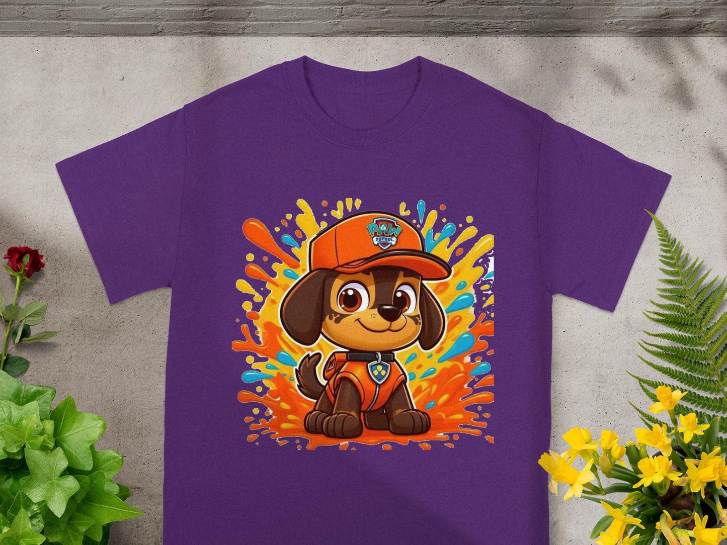 Purple t-shirt with animated cartoon dog character and colorful paint splatters.