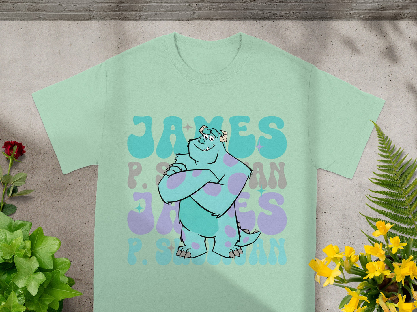 Blue and purple Sully t-shirt with "James P. Sullivan" text design.