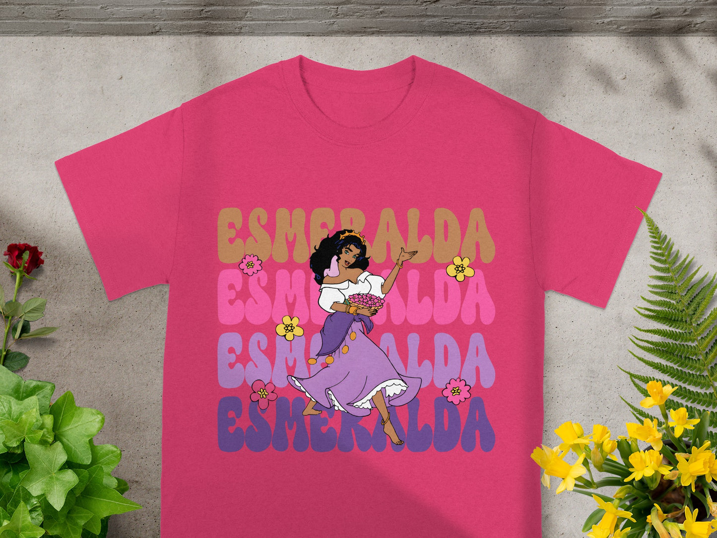 T-shirt with "Esmeralda" text and cartoon character of a woman in a purple dress.