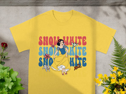 Snow White and bluebirds graphic on yellow t-shirt with floral accents.