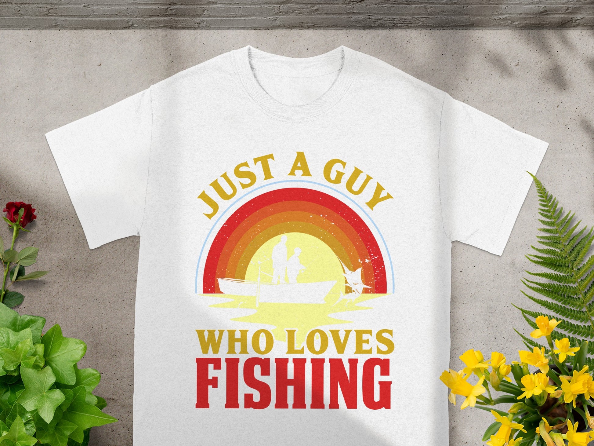 White t-shirt with text "Just A Guy Who Loves Fishing" and a fishing scene.