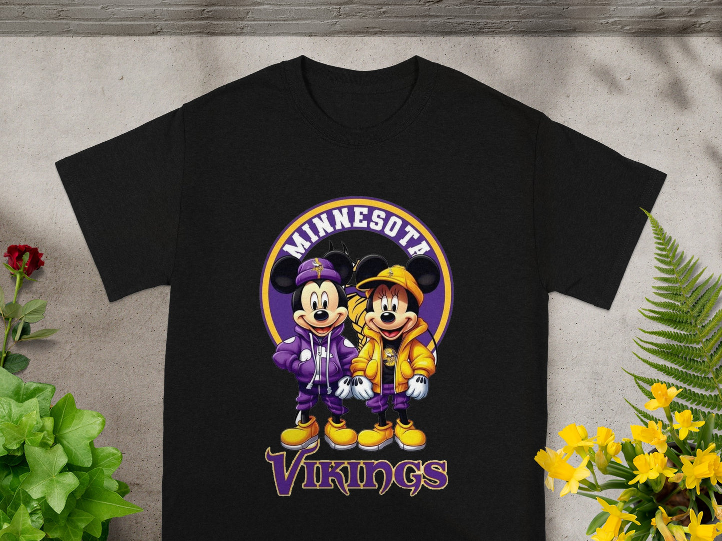 Mickey and Minnie Mouse in Minnesota Vikings purple and gold jackets.