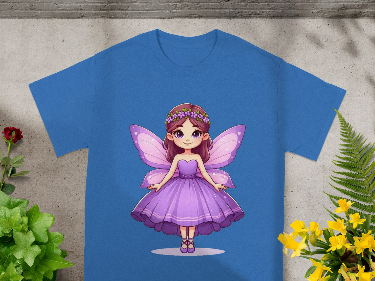 Purple fairy with wings on a blue t-shirt.