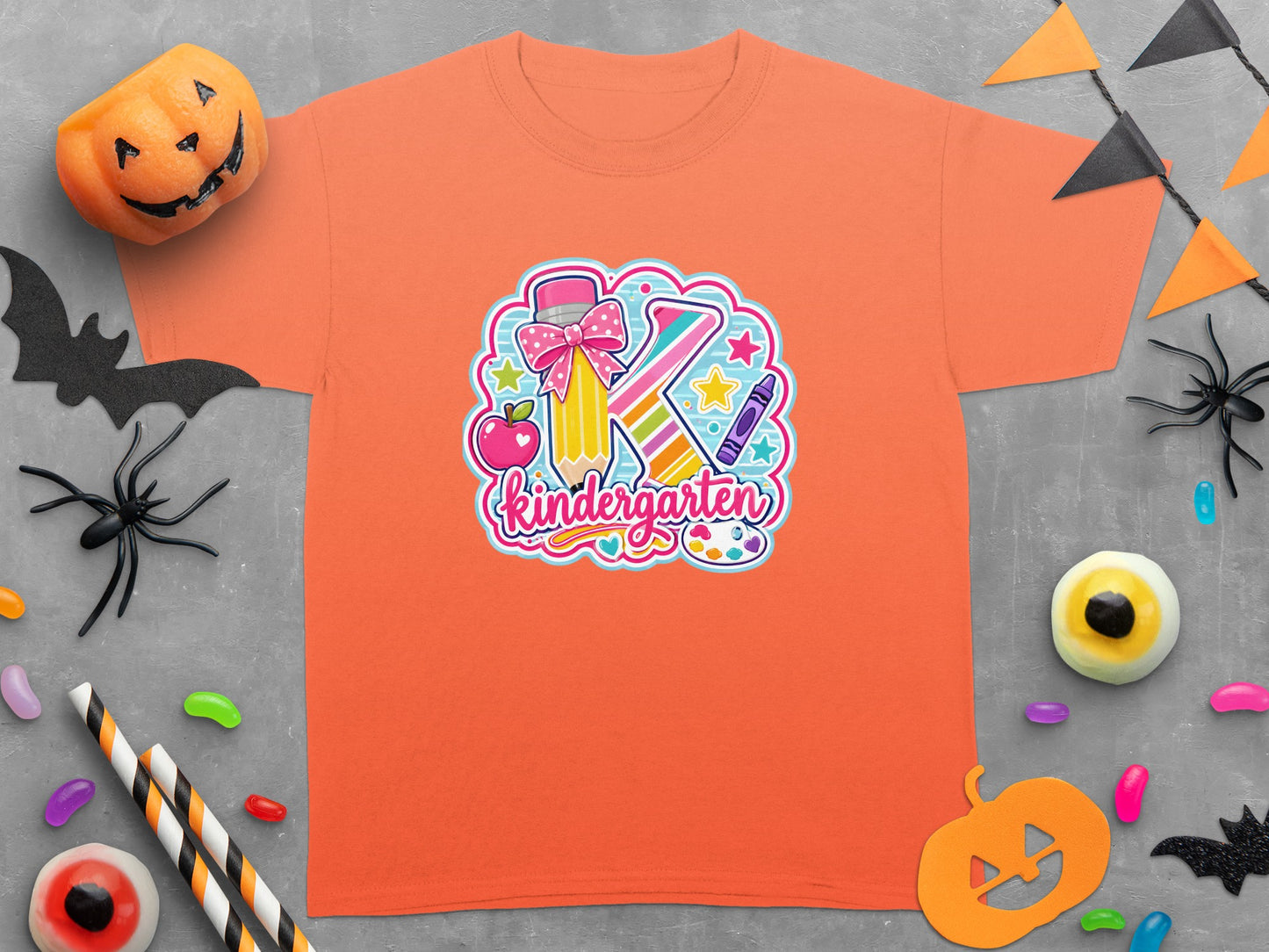 Orange t-shirt with "Kindergarten" design featuring a pencil, apple, crayon, and letter K.