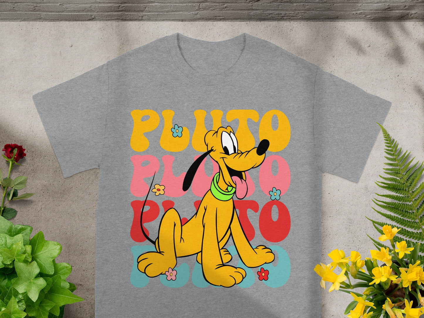 Grey t-shirt featuring retro Pluto graphic with colorful text.