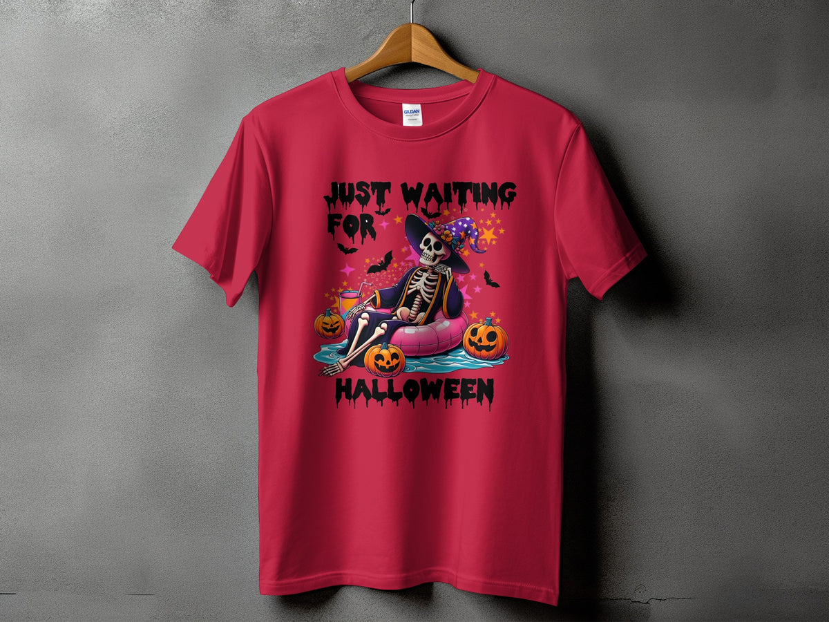 Skeleton floating on an inflatable ring with pumpkins and the text "Just Waiting For Halloween".