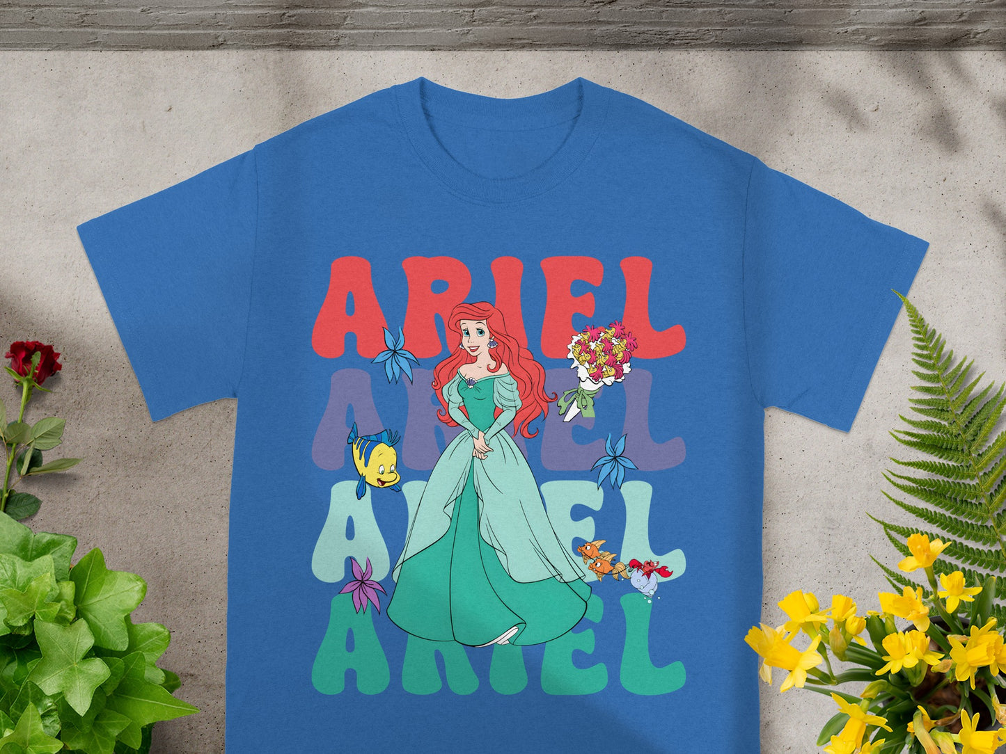 Blue t-shirt with Ariel and "ARIEL" text design.