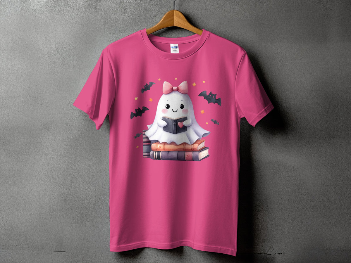 Pink t-shirt with a cute ghost reading a book on stacked books.