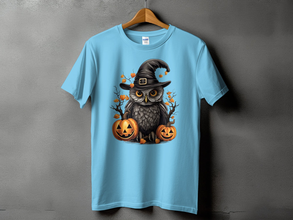 Light blue t-shirt with a Halloween owl wearing a witch hat and surrounded by pumpkins.