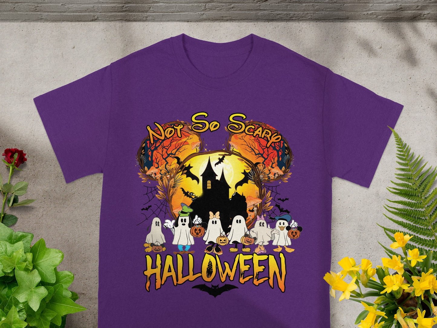 Purple t-shirt with "Not So Scary Halloween" text and cartoon ghosts with pumpkins.