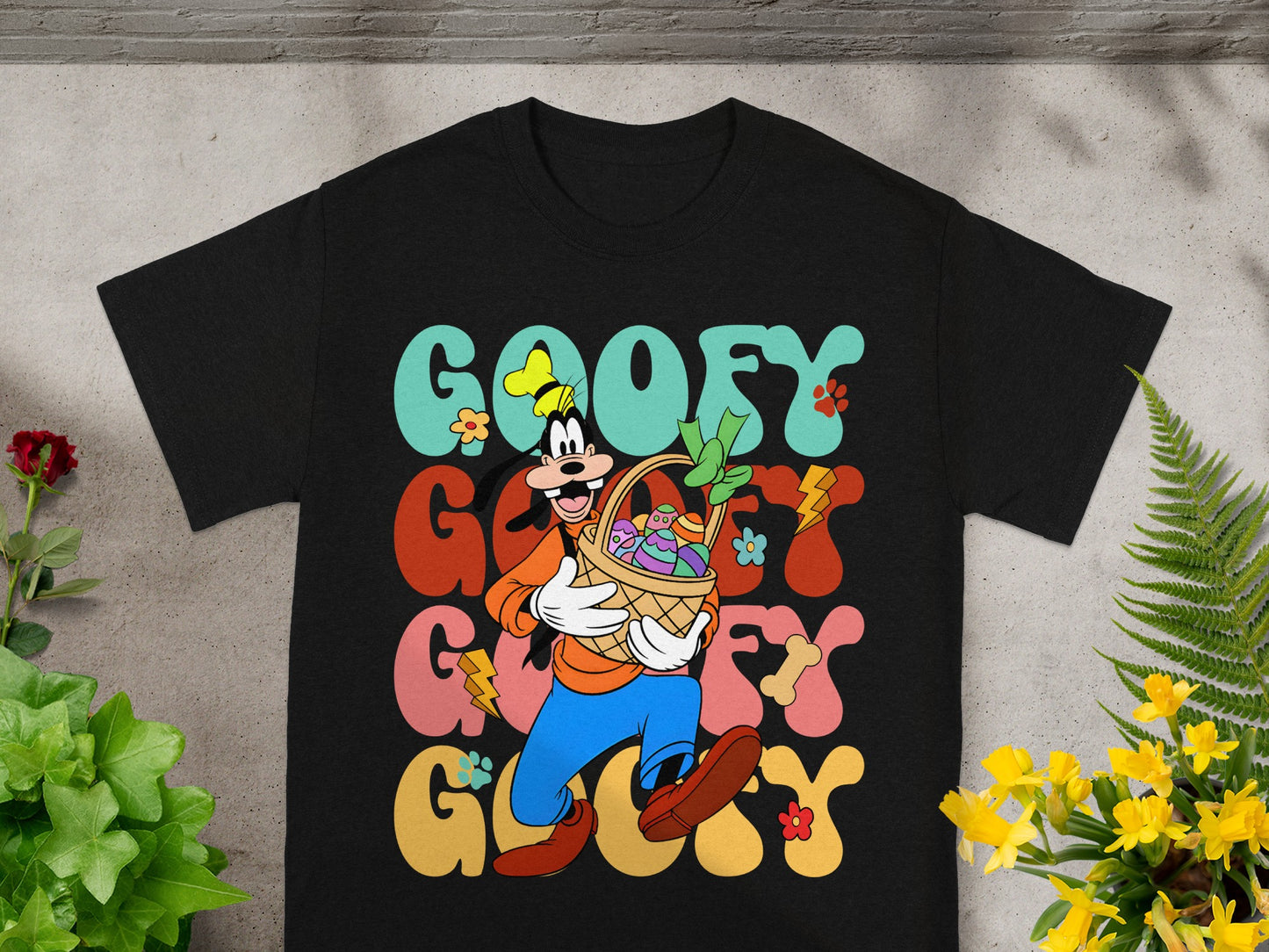 Black t-shirt with "Goofy" text and cartoon Goofy holding an Easter basket.