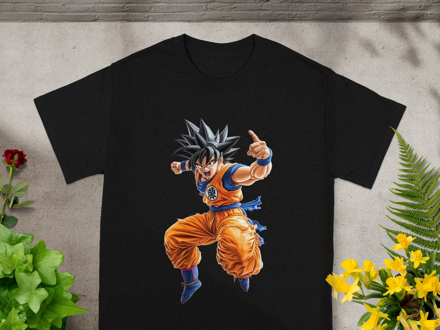 Black t-shirt with Goku in orange gi, pointing finger.