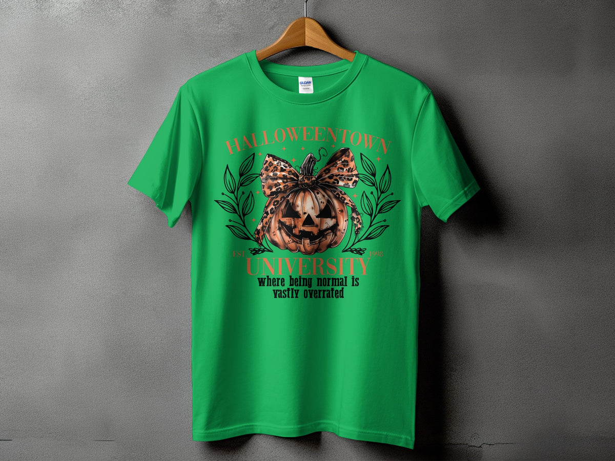 Green t-shirt with a Halloween town university graphic featuring a pumpkin with a leopard print bow.