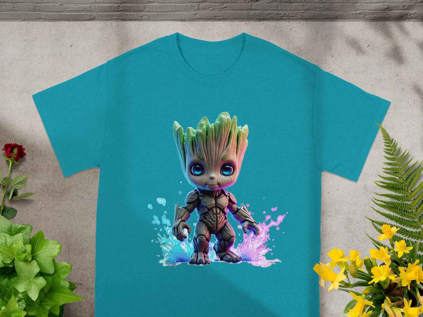 Teal t-shirt with cartoon Groot character in colorful splatter.