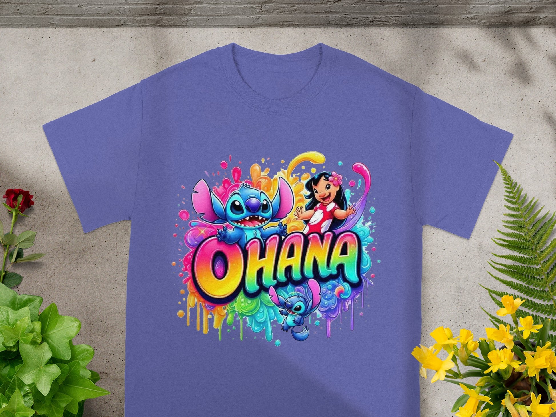 Lilo and Stitch characters with colorful splatter paint on a purple t-shirt.