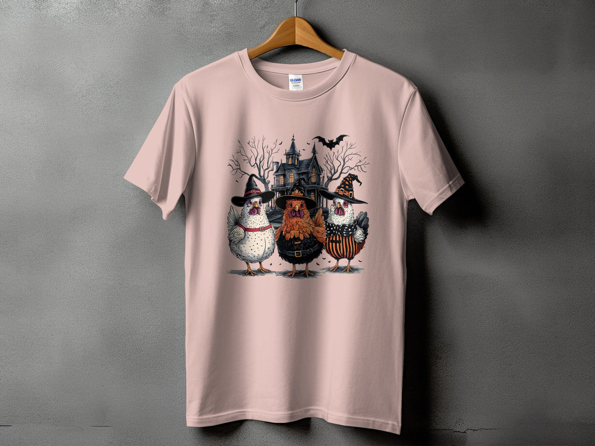 Three chickens in witch hats in front of a spooky house with a bat.