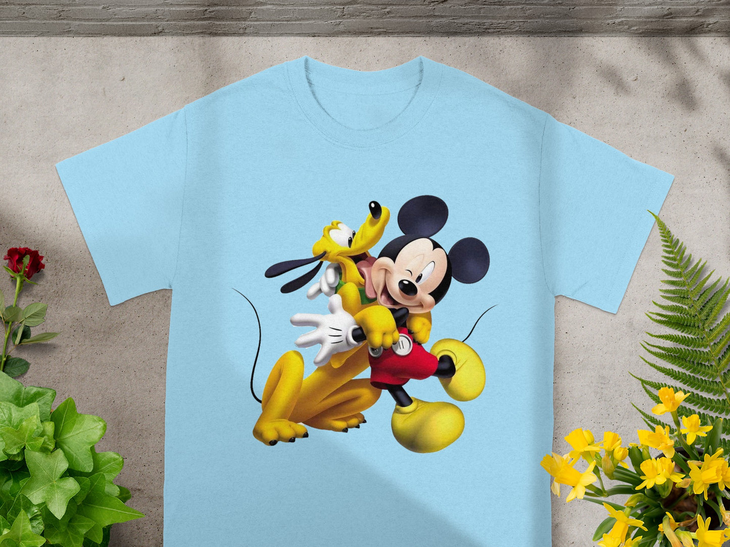 Light blue t-shirt with Mickey Mouse and Pluto cartoon characters.