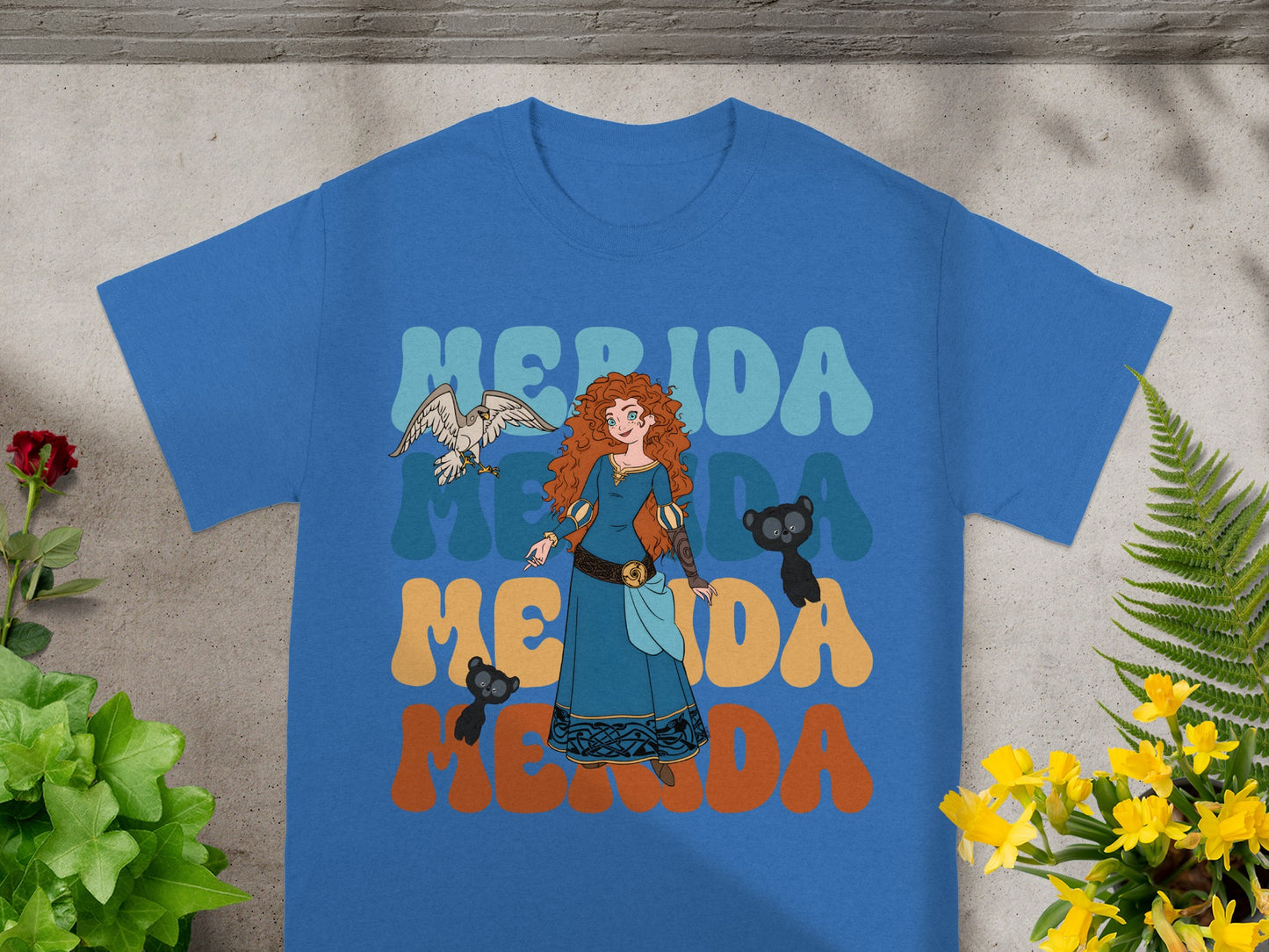 Blue t-shirt with Merida and her bear cubs in colorful text.