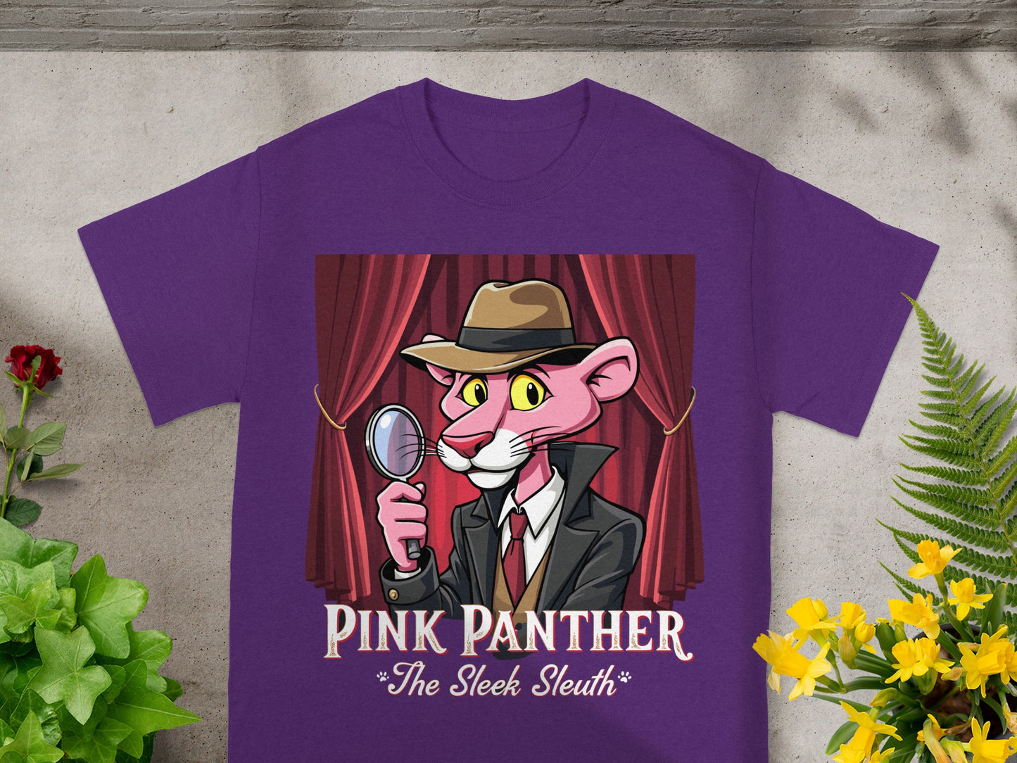 Purple t-shirt with Pink Panther detective graphic and text "Pink Panther *The Sleek Sleuth*".