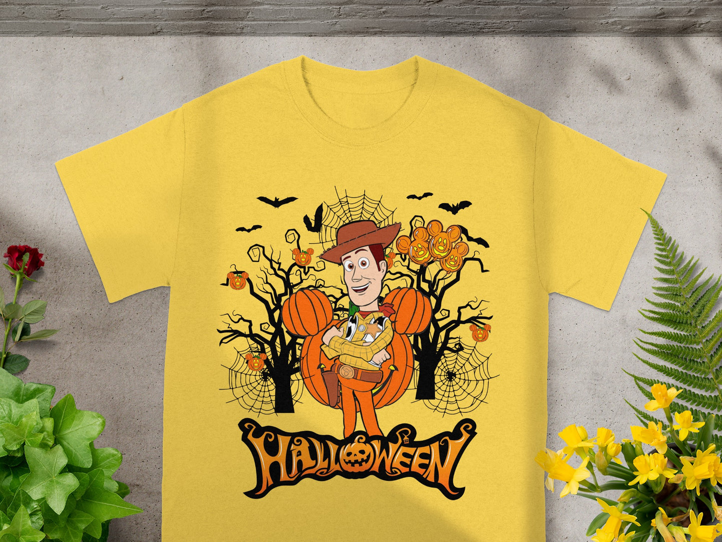 Yellow t-shirt with Woody character and Halloween pumpkins, bats, and "Halloween" text.