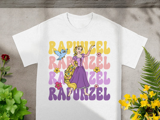 Rapunzel and Pascal on a white t-shirt with colorful lettering.