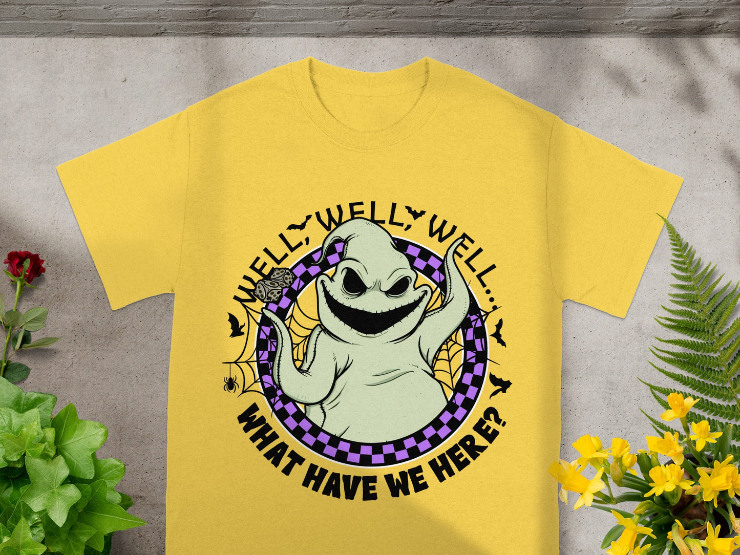 Yellow t-shirt with Oogie Boogie graphic and text "Well, well, well... What have we here?".