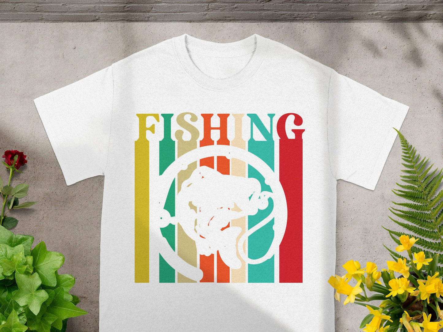 White t-shirt with colorful stripes and a white fish graphic.