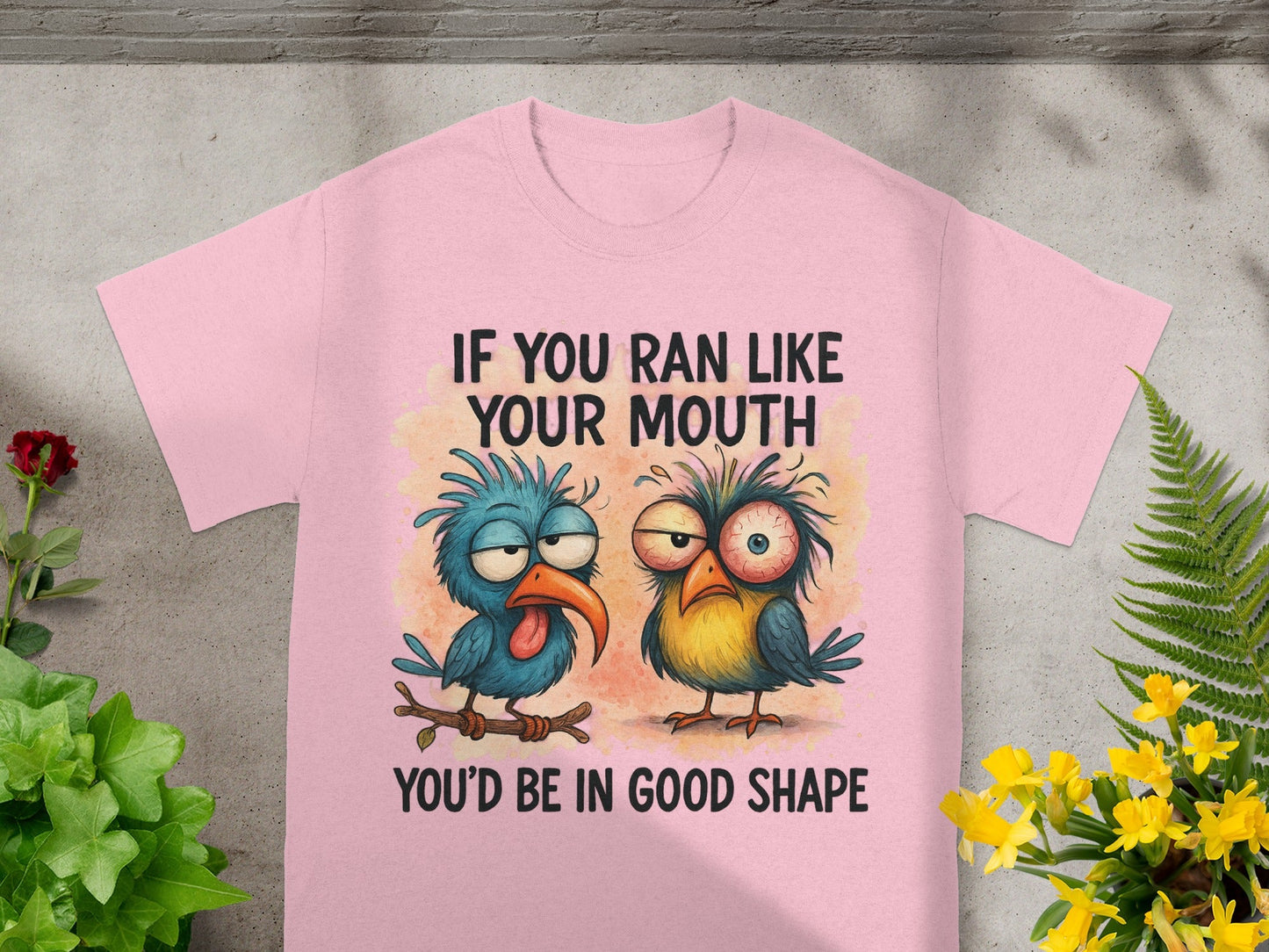 Pink t-shirt with cartoon birds and text: "IF YOU RAN LIKE YOUR MOUTH YOU'D BE IN GOOD SHAPE."