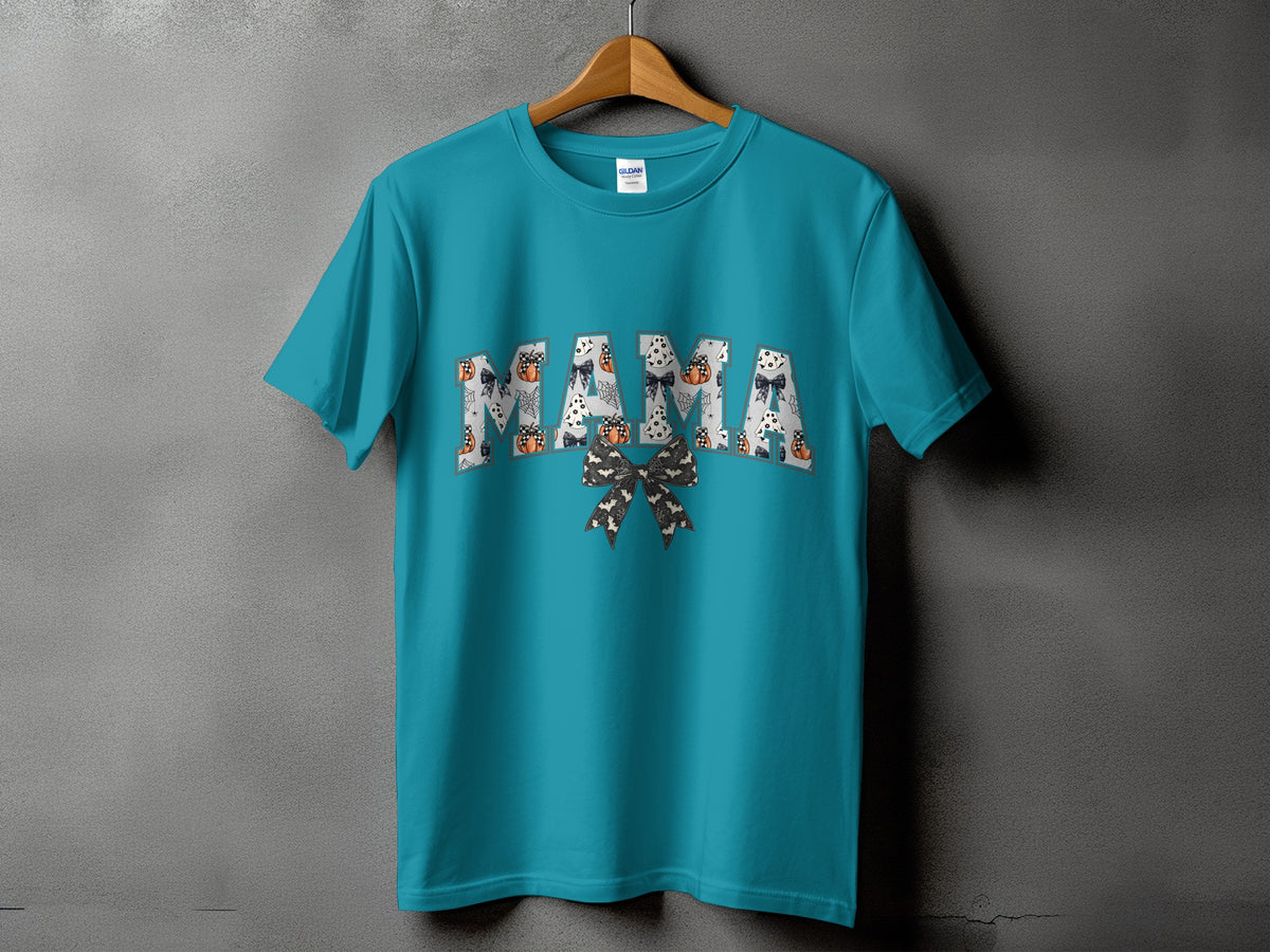 Teal t-shirt with "MAMA" text filled with Halloween patterns and a bow.