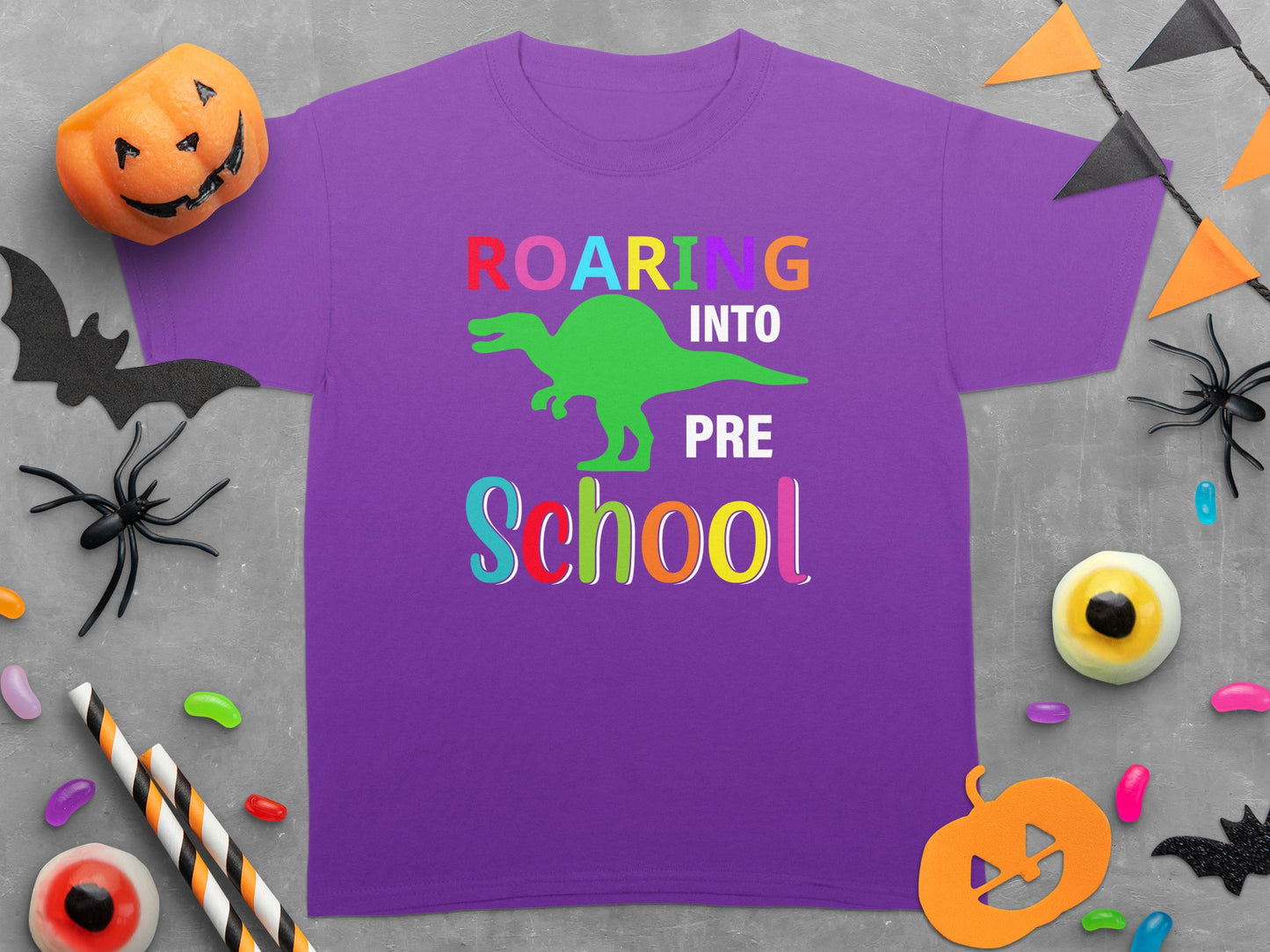 Purple t-shirt with "Roaring into Pre School" and dinosaur graphic.