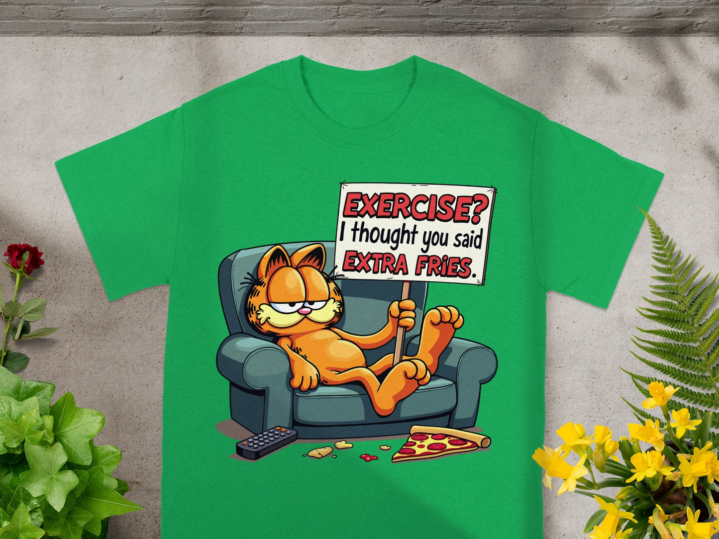 Green t-shirt with Garfield sitting on a couch holding a sign saying "EXERCISE? I thought you said EXTRA FRIES."