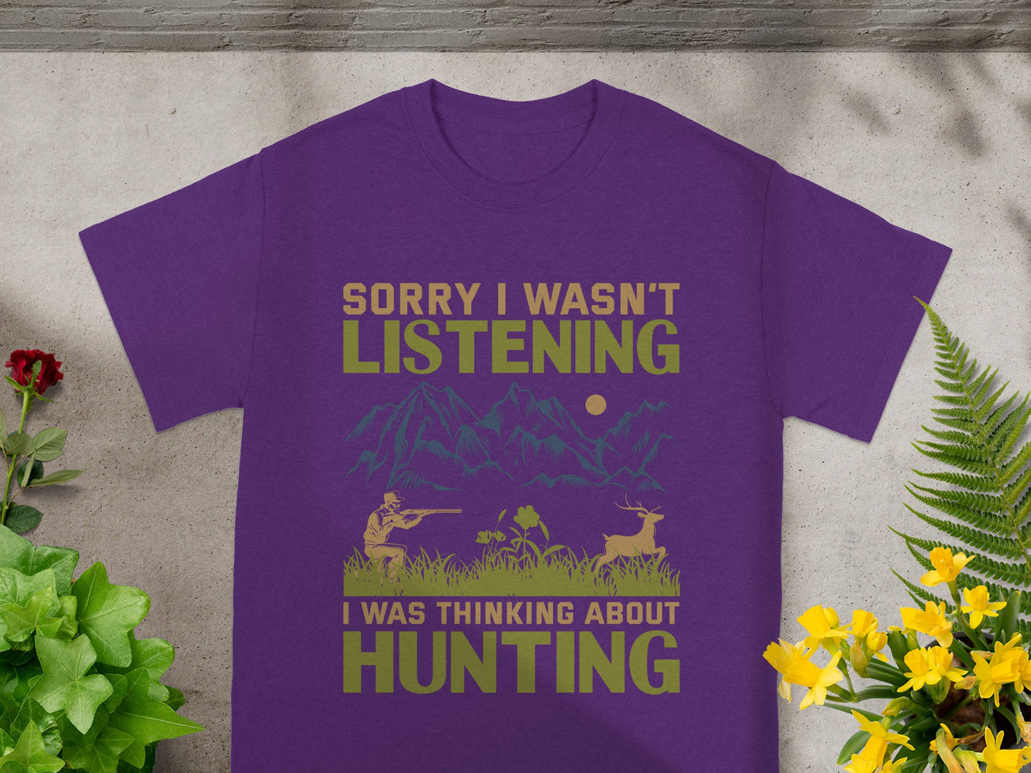 Purple t-shirt with text "Sorry I wasn't listening, I was thinking about hunting".