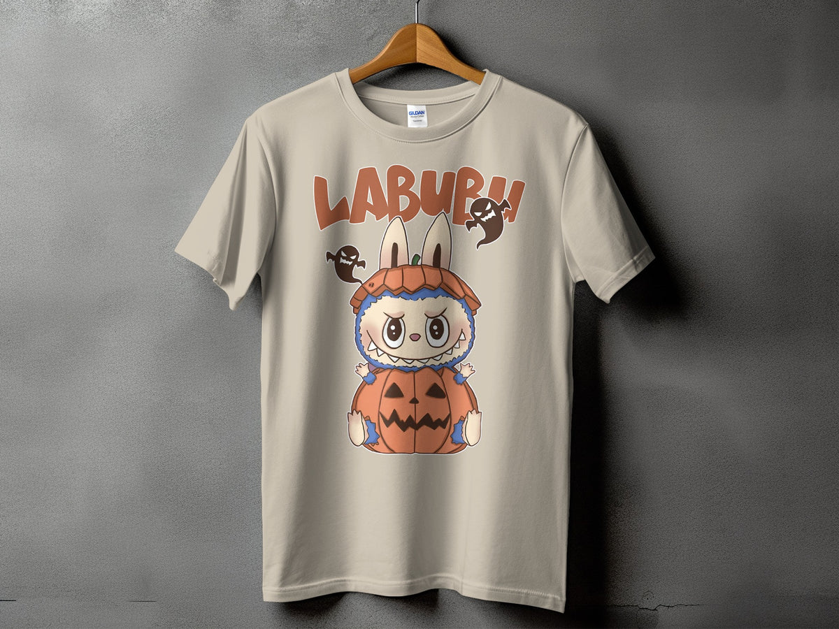 Light tan t-shirt with Labubu character in pumpkin costume and ghosts.